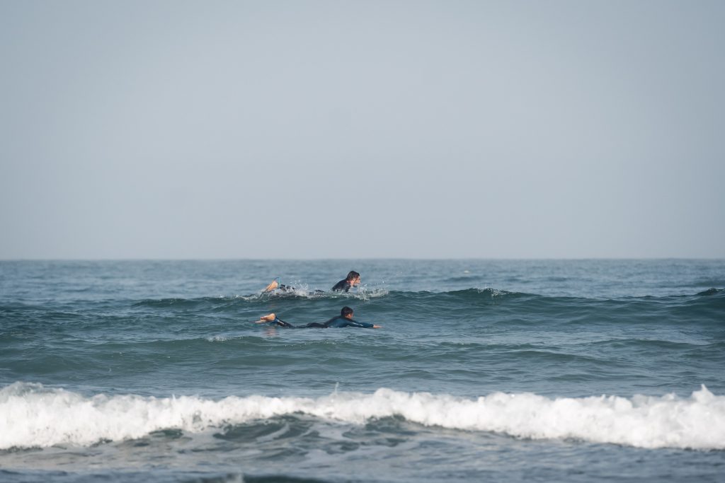 Imsouane Surf Camp: Learning to Ride the Bay - Complete Guide 2025 3 Imsouane surf camp instructors teaching surf technique Morocco
